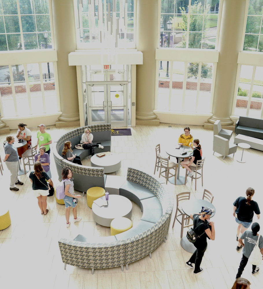 Crown walking around in the Center for the Arts main lobby