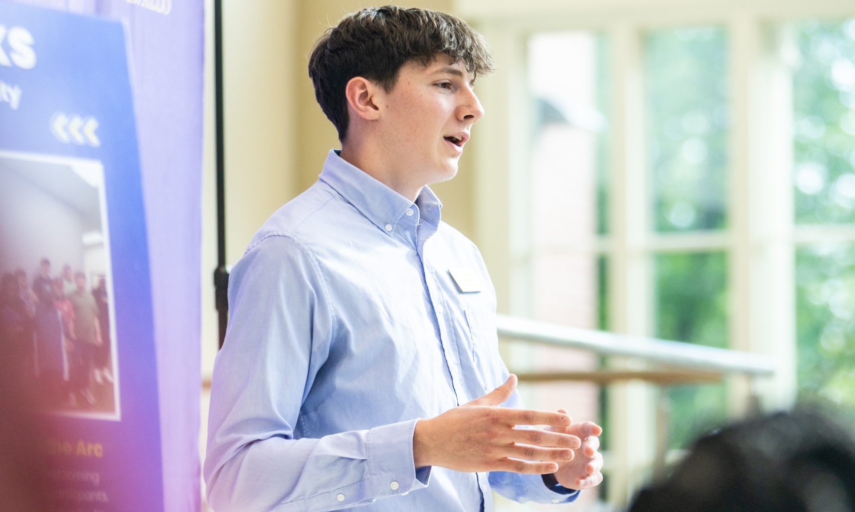 A student delivers a speech at the Falcon Scholars in Action showcase