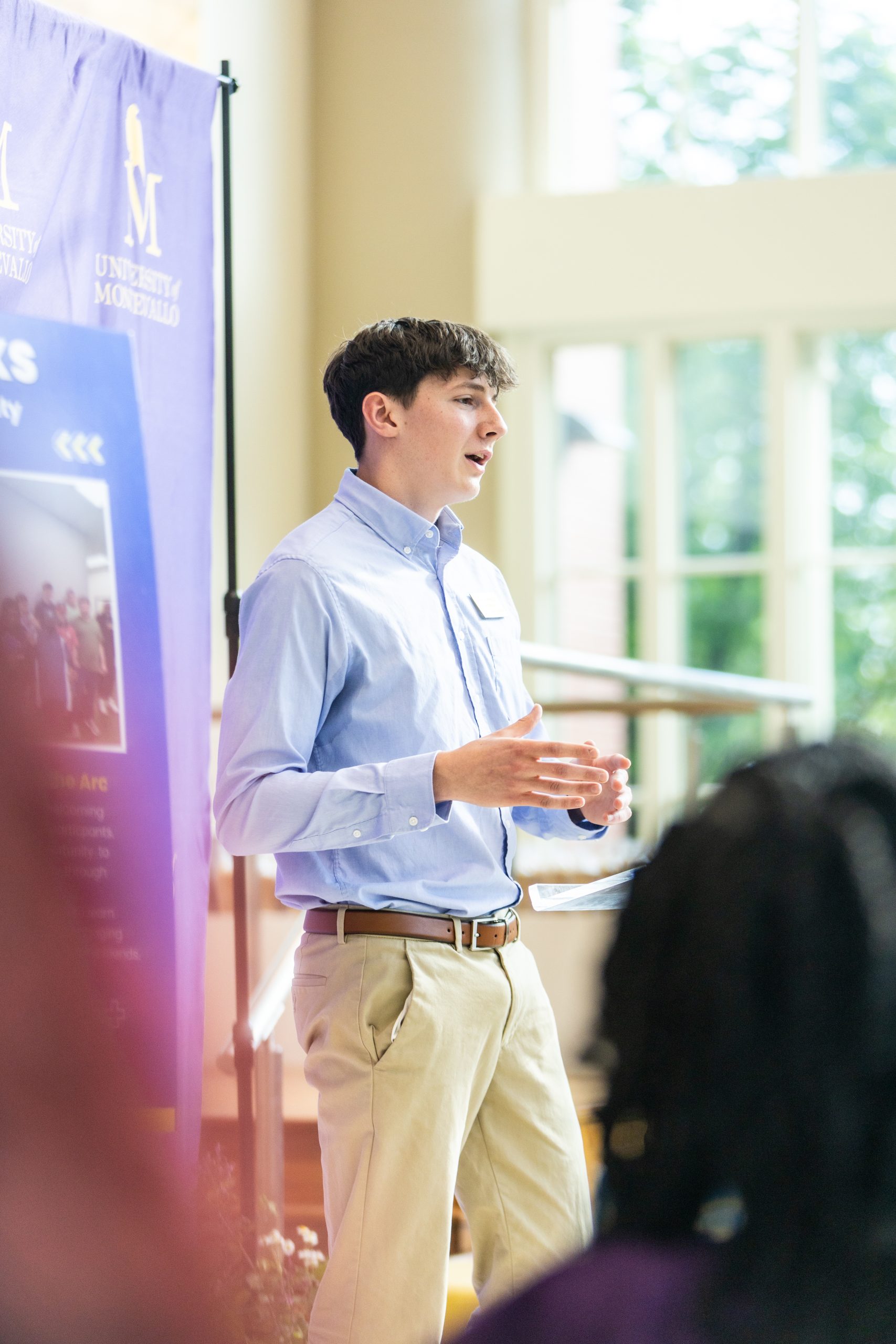 A student delivers a speech at the Falcon Scholars in Action showcase