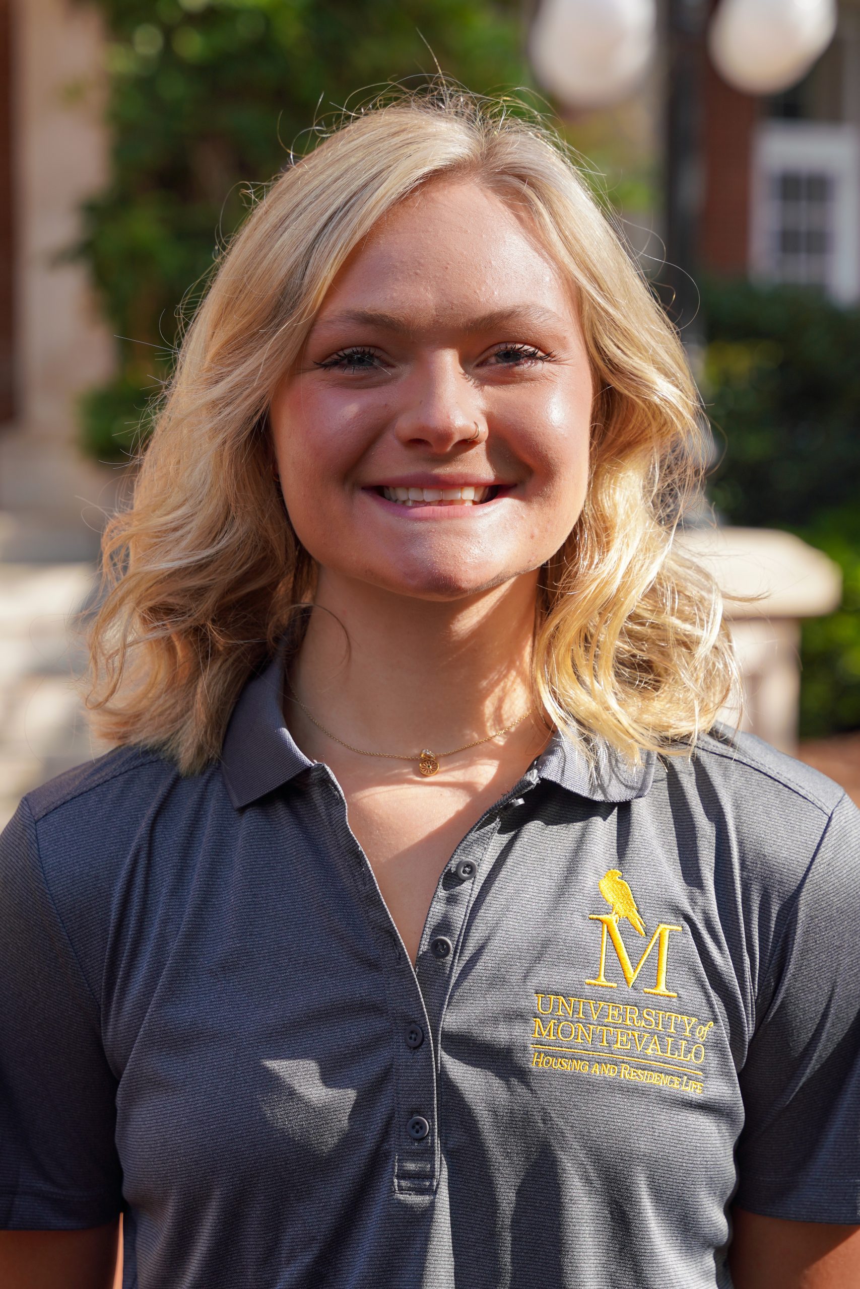 Headshot of Hallie Harrell - showing a female in a grey shirt with blond hair