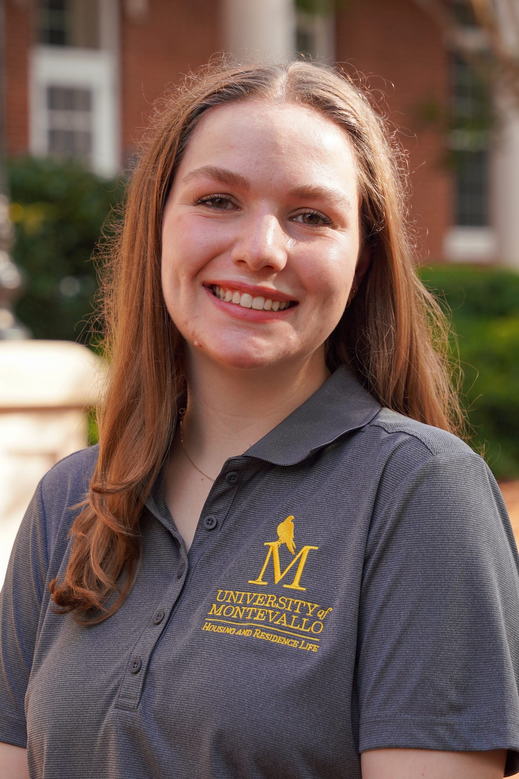 Headshot of Rachel Johnson - female in grey shirt with long brown hair