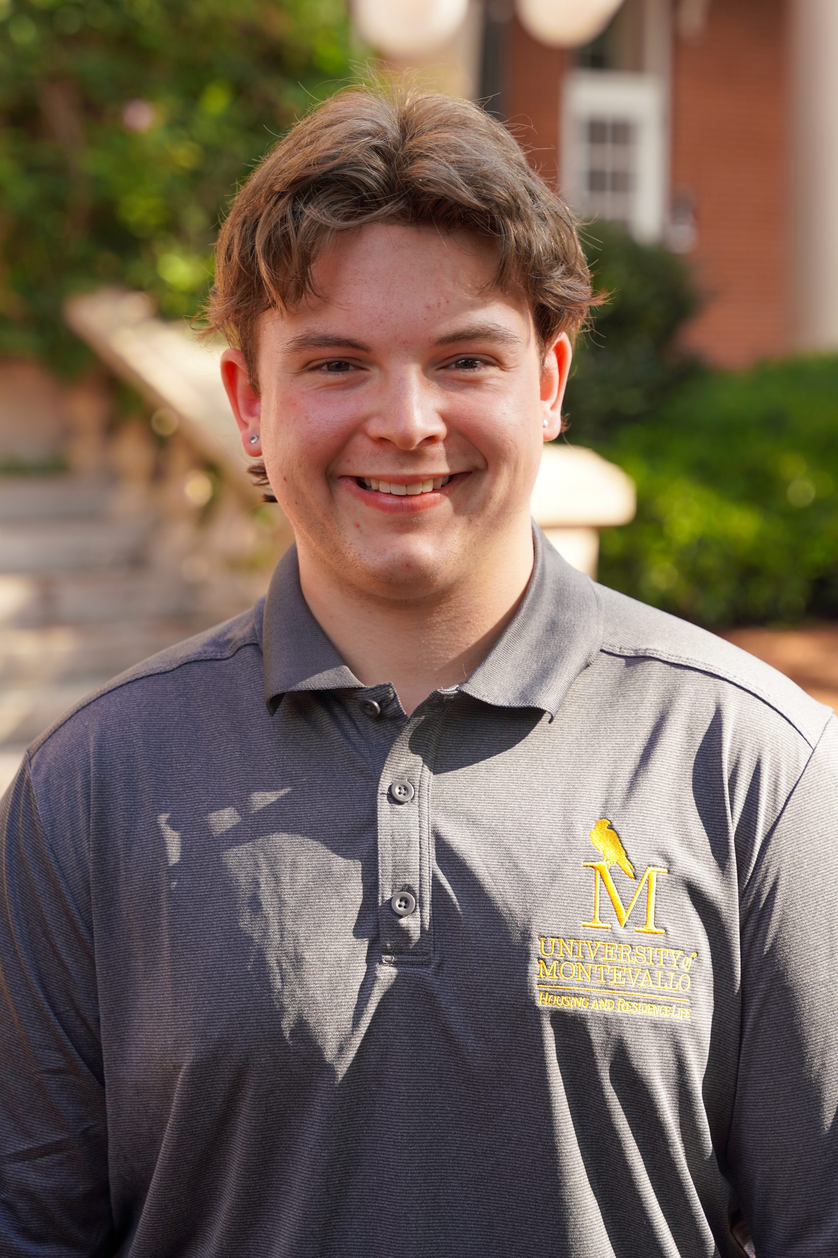 Headshot of Kooper Rooks - male in grey shirt with brown hair