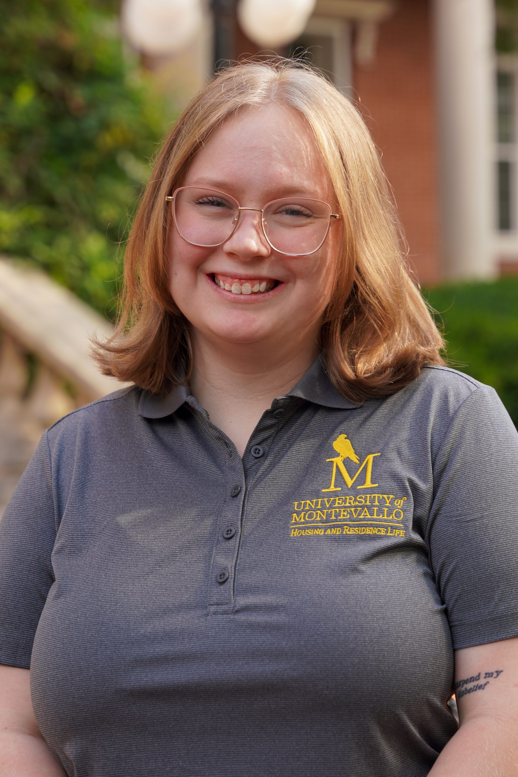 Headshot of Bethany Singleton - female in grey shirt with blonde hair and eyeglasses